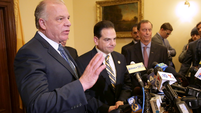 Senate President Steve Sweeney, left, speaks to reporters in Trenton, N.J., Monday, March 25, 2019.