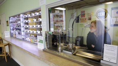 A representative at the Northwest Patient Resource Center medical marijuana dispensary in Seattle, Wednesday, Oct. 10, 2012.