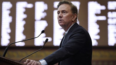 In this Wednesday, Feb. 20, 2019, photo, Connecticut Gov. Ned Lamont delivers his budget address at the State Capitol in Hartford, Conn.