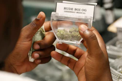 In this April 20, 2018, file photo, a customer shops for marijuana at the Exhale Nevada dispensary in Las Vegas.