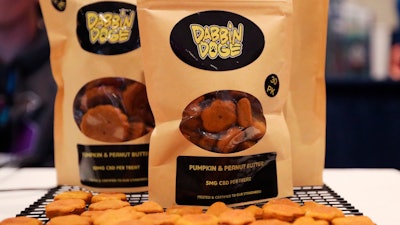 Dog treats are displayed at the Cannabis World Congress & Business Exposition trade show, Thursday, May 30, 2019, in New York.