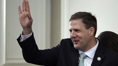 Republican Gov. Chris Sununu waves during his inauguration ceremony at the State House in Concord, N.H., Thursday, Jan. 3, 2019.