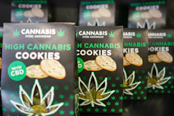 In this Thursday, June 6, 2019, photo, boxes of cookies are on sale at a cannabis light store in Rome.