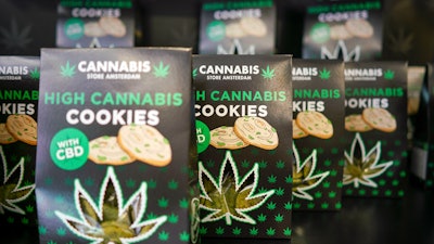 In this Thursday, June 6, 2019, photo, boxes of cookies are on sale at a cannabis light store in Rome.