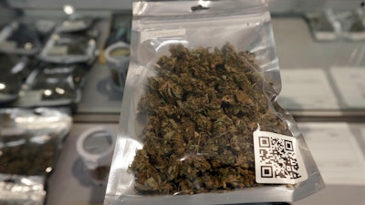 In this photo taken Thursday, June 20, 2019, packaged smokable hemp flower is seen on the counter at the Hemp Farmacy in Raleigh, N.C.