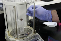 In this Friday, Aug. 16, 2019, photo, chemist David Dawson pours pieces of a cannabis-infused chocolate bar into a vial as he demonstrates testing for THC and other chemicals at CW Analytical Laboratories in Oakland, Calif. Chemists are trying to solve a scientific mystery involving marijuana brownies. Chocolate seems to throw off test results for potency. That could be dangerous for consumers looking to relax, not hallucinate.