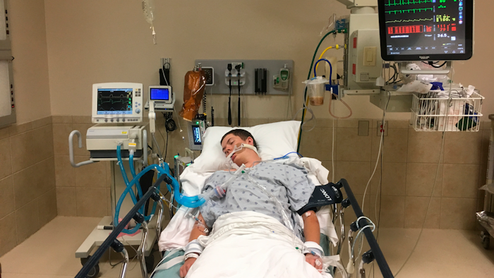 This May 2018 photo, provided by Joseph Jenkins, shows his son, Jay, in the emergency room of the Lexington Medical Center in Lexington, S.C.