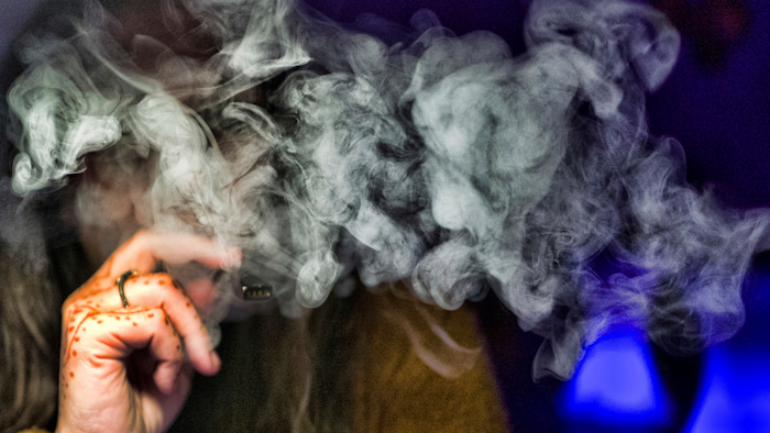 In this Dec. 22, 2018, file photo, a woman takes a puff from a cannabis vape pen in Los Angeles.