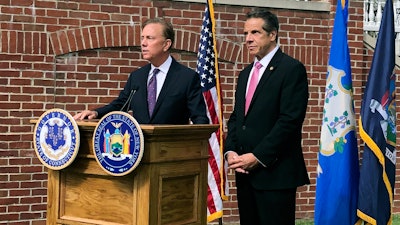 Connecticut Gov. Ned Lamont, left, and New York Gov. Andrew Cuomo at a press conference in Hartford, Conn., Sept. 25, 2019.