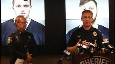 Capt. Dan Baumann of the Waukesha Police Department, right, with Kenosha County Sheriff David Beth during a news conference in Kenosha, Wis., Sept. 11, 2019.