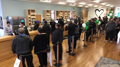 In this Jan. 4, 2018, file photo, customers line up inside the Harborside cannabis dispensary in Oakland, Calif.