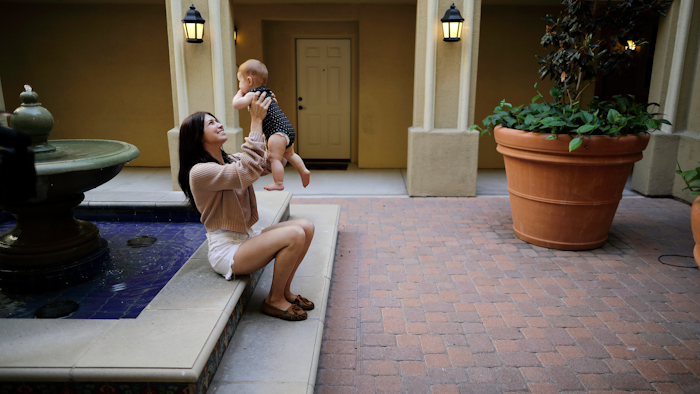 In this Aug. 24, 2018, file photo, Keira Sumimoto plays with her daughter in Irvine, Calif.
