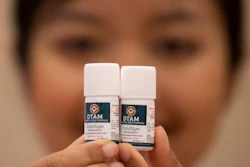 A doctor shows containers of cannabis oil at a clinic in Nonthaburi province, Thailand, Jan. 6, 2020.