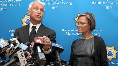 San Francisco district attorney George Gascon, left, and Code For America founder Jennifer Pahlka at a press conference in San Francisco, Feb. 25, 2019.