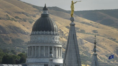 The Salt Lake Temple with the Utah State Capitol in the background, Salt Lake City, July 26, 2017.