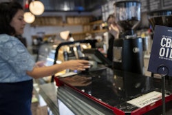 A sign advertising shots of CBD oil at Le District in New York, Oct. 8, 2019.