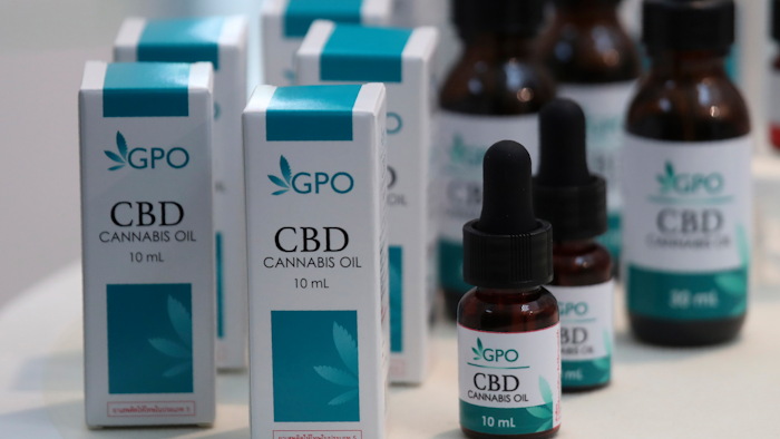Bottles of extracted cannabis oil displayed at Thailand's Health Ministry in Bangkok, Aug. 7, 2019.