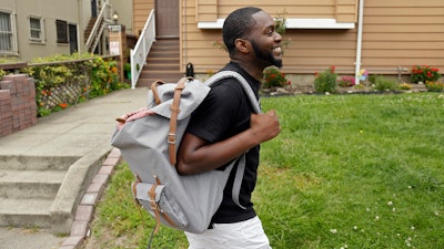 Andre Shavers, who runs a marijuana delivery business, on a street in Oakland, Calif., May 11, 2017.