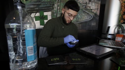 An employee at Green Cross cannabis dispensary in San Francisco, March 18, 2020.