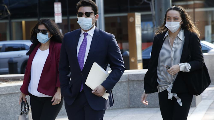 Former Fall River Mayor Jasiel Correia, center, arrives to the John Joseph Moakley United States Courthouse, Boston, April 26, 2021.
