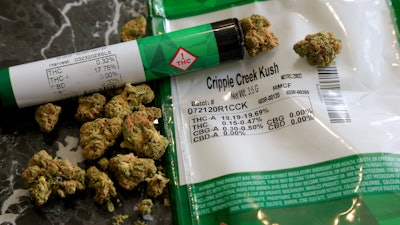 The THC percentages of recreational marijuana visible on the product packaging on a countertop in Mamaroneck, N.Y., April 19, 2021.