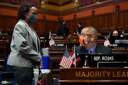 Connecticut House Majority Leader Jason Rojas, D-East Hartford, speaks with Rep. Toni Walker, D-New Haven, during session at the State Capitol in Hartford, April 19, 2021.