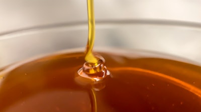 THC oil produced using Green Mills Real-Time Winterization, straight from the extraction machine.