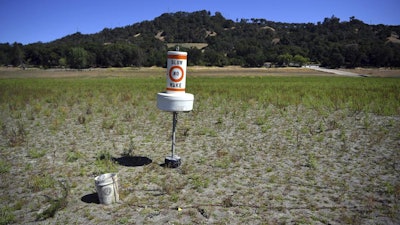 Buoy on dry land at drought-stricken Lake Mendocino, Ukiah, Calif., May 23, 2021.