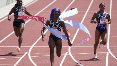 Sha'Carri Richardson, center, wins the women's 100-meter dash during the USATF Golden Games meet, Mount San Antonio College, Walnut, Calif., May 9, 2021.