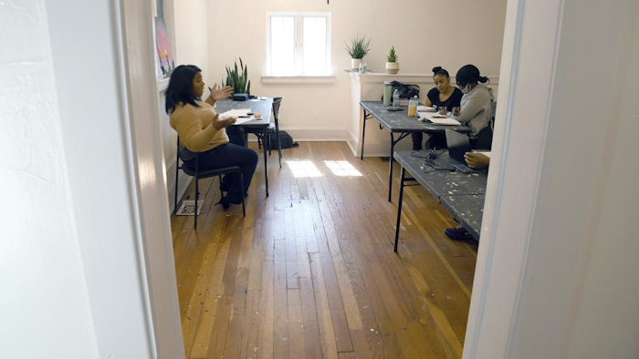 Sarah Woodson, left, teaches a class on social equity in the marijuana industry, Denver, April 3, 2021.