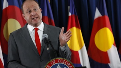 Colorado Gov. Jared Polis during a news conference in Denver, July 28, 2020.