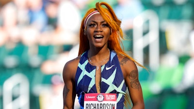 Sha'Carri Richardson celebrates after winning the first heat of the semis finals in women's 100-meter run at the U.S. Olympic Track and Field Trials in Eugene, Ore., June 19, 2021.