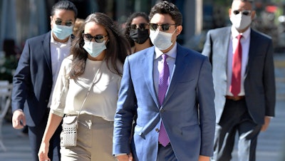 Former Fall River, Mass., Mayor Jasiel Correia, right, arrives with his wife Jenny Fernandes and family members for a court appearance, Boston, Sept. 20, 2021.