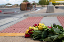 A bouquet of flowers placed near the basket of a hot air balloon that crashed in Albuquerque, N.M., June 26, 2021.