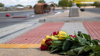 A bouquet of flowers placed near the basket of a hot air balloon that crashed in Albuquerque, N.M., June 26, 2021.