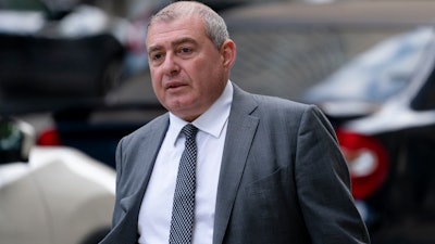 Lev Parnas walks past criminal court in New York, Oct. 18, 2021.