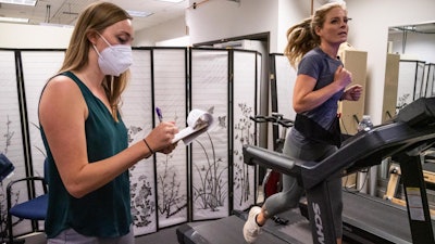 Laurel Gibson, a PhD student in the Department of Psychology and Neuroscience, asks ultramarathon runner Heather Mashhoodi questions as part of a new study exploring how marijuana influences exercise.