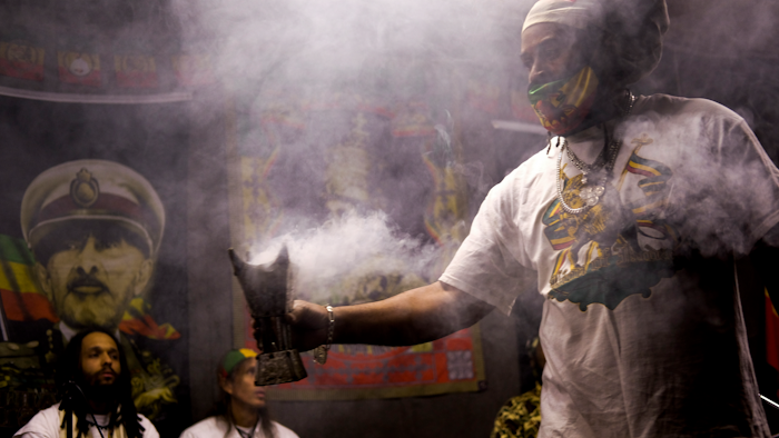 Frankincense wafts from a burner held by Ras Jahbo during an event marking the 91st anniversary of the coronation of the late Ethiopian Emperor Haile Selassie I, Columbus, Ohio, Nov. 2, 2021.