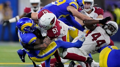 Arizona Cardinals linebacker Tanner Vallejo (51) tackles Los Angeles Rams running back Cam Akers during the first half of an NFL wild-card playoff football game in Inglewood, Calif., Jan. 17, 2022.