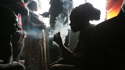 A group of men use drugs, Harare, Zimbabwe, Nov 20, 2021.