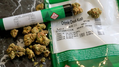 The THC percentages of recreational marijuana are visible on the product packaging sitting on a countertop, April 19, 2021, in Mamaroneck, N.Y. New York is proposing a $200 million fund to help people of color, women and some others start marijuana businesses.