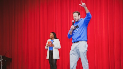Pete Kadens shares the stage with Hope Chicago CEO Dr. Janice Jackson at Farragut Career Academy High School, Chicago, Feb. 25, 2022.