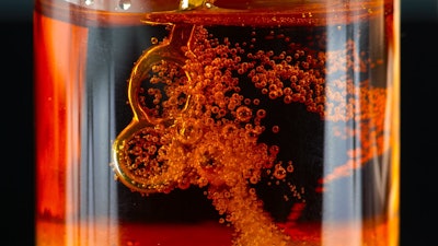 A vial of carbonated HTFSE created with the Cosolvent cannabis extraction method that utilizes both CO2 and butane as extraction solvents.