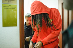 WNBA star and two-time Olympic gold medalist Brittney Griner leaves a courtroom after a hearing, in Khimki just outside Moscow, Russia, Friday, May 13, 2022. Griner, a two-time Olympic gold medalist, was detained at the Moscow airport in February after vape cartridges containing oil derived from cannabis were allegedly found in her luggage, which could carry a maximum penalty of 10 years in prison.
