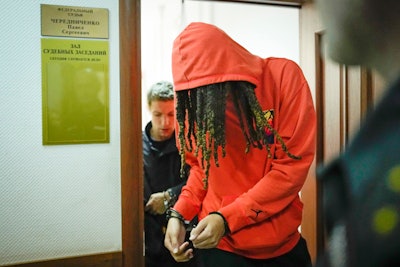 WNBA star and two-time Olympic gold medalist Brittney Griner leaves a courtroom after a hearing, in Khimki just outside Moscow, Russia, Friday, May 13, 2022. Griner, a two-time Olympic gold medalist, was detained at the Moscow airport in February after vape cartridges containing oil derived from cannabis were allegedly found in her luggage, which could carry a maximum penalty of 10 years in prison.