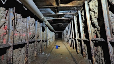 This undated photo provided by Homeland Security Investigations shows the inside of a cross border tunnel between Mexico's Tijuana into the San Diego area. Authorities announced on Monday, May 16, 2022, the discovery of the underground smuggling tunnel on Mexico's border, running the length of a football field on U.S. soil to a warehouse in an industrial area. The cross-border tunnel from Tijuana to the San Diego area was built in one of the most fortified stretches of the border, illustrating the limitations of former President Donald Trump's border wall.
