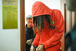WNBA star and two-time Olympic gold medalist Brittney Griner leaves a courtroom after a hearing, in Khimki just outside Moscow, Russia, Friday, May 13, 2022. Griner, a two-time Olympic gold medalist, was detained at the Moscow airport in February after vape cartridges containing oil derived from cannabis were allegedly found in her luggage, which could carry a maximum penalty of 10 years in prison.