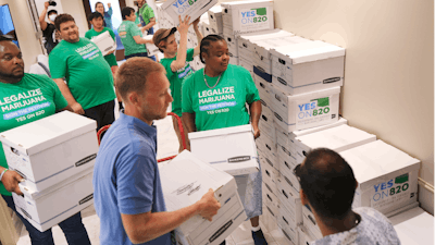 Oklahomans for Sensible Marijuana Laws delivers more than 164,000 signatures to the Office of the Secretary of State at the Oklahoma state Capitol in Oklahoma City, July 5, 2022.