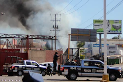 The police arrives on the scene after a store was looted in Culiacan, Sinaloa state, Thursday, Jan. 5, 2023. Mexican security forces captured Ovidio Guzmán, an alleged drug trafficker wanted by the United States and one of the sons of former Sinaloa cartel boss Joaquín “El Chapo” Guzmán, in a pre-dawn operation Thursday that set off gunfights and roadblocks across the western state’s capital.
