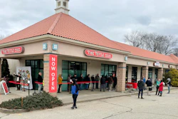 Customers wait in line outside the Fine Fettle marijuana dispensary in Willimantic, Conn., Tuesday, Jan. 10, 2023, for the opening of legal sales of recreational marijuana in Connecticut.